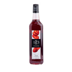 Bottle of 1883 syrup with strawberry flavor on a white background