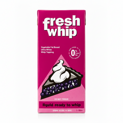 A 1 litre carton of Fresh Whip liquid ready to whip, featuring a vibrant magenta-pink box with white branding and an illustration of a berry pie slice topped with whipped cream.
