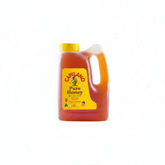 A 23 kg plastic jug of Capilano Pure Honey with a yellow cap and a yellow label featuring the brand name and bee logo, set against a plain white background.