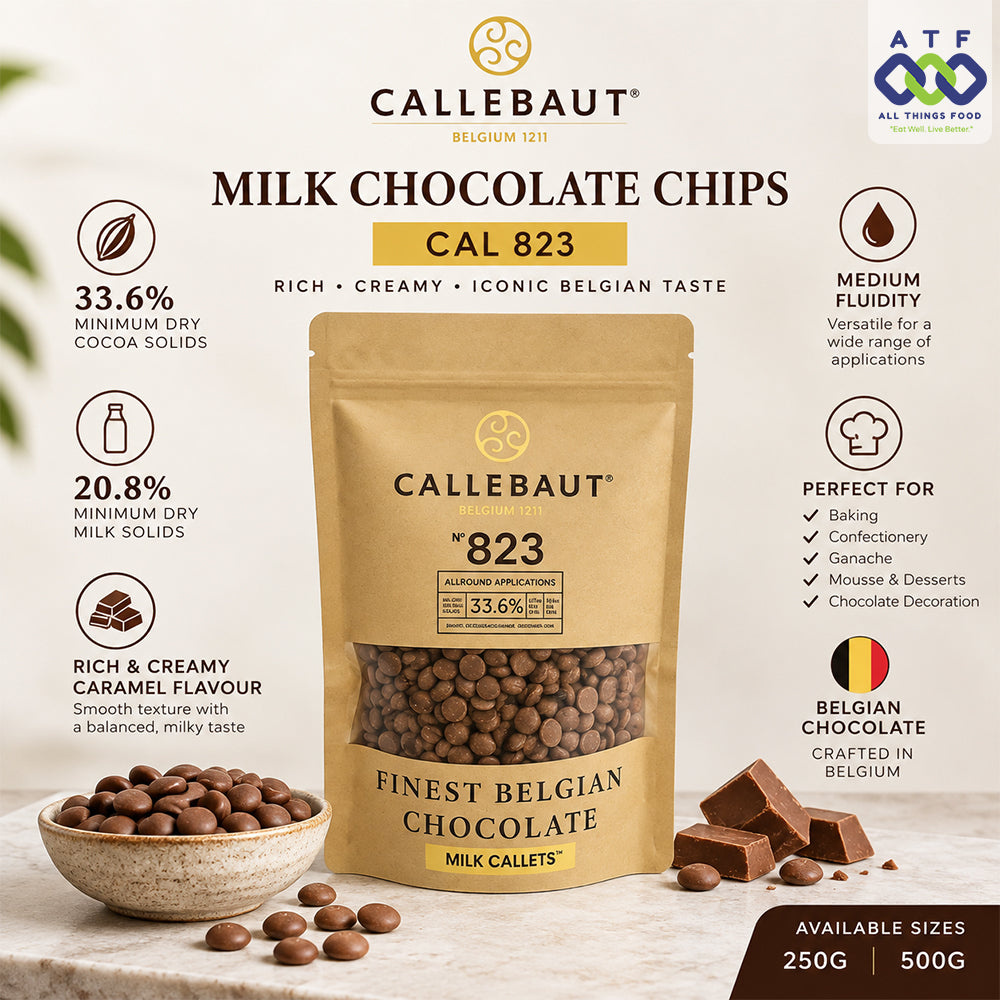 A 500g stand-up pouch of Callebaut Milk Chocolate Chips (Cal 823) with product details, chocolate pieces, and a bowl of chocolate chips.