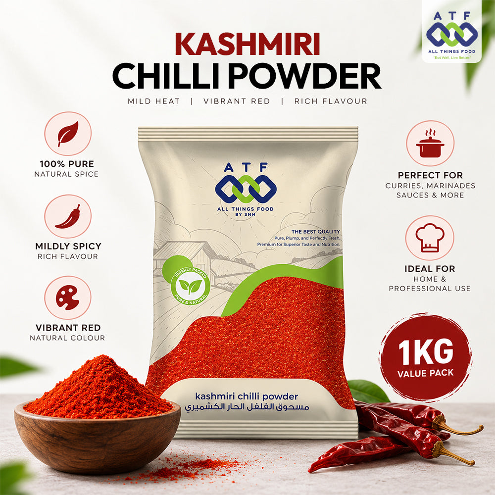 A 1kg package of ATF All Time Food By SF Kashmiri Chilli Powder, displayed with a wooden bowl of red powder, whole red chilies, and descriptive text highlighting its vibrant red color, mild heat, and rich flavor.