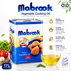 Mabrook Pure Vegetable Oil 17L metal tin packaging shown with promotional text, a glass of golden oil, and food props including tomatoes, garlic, and green leaves.