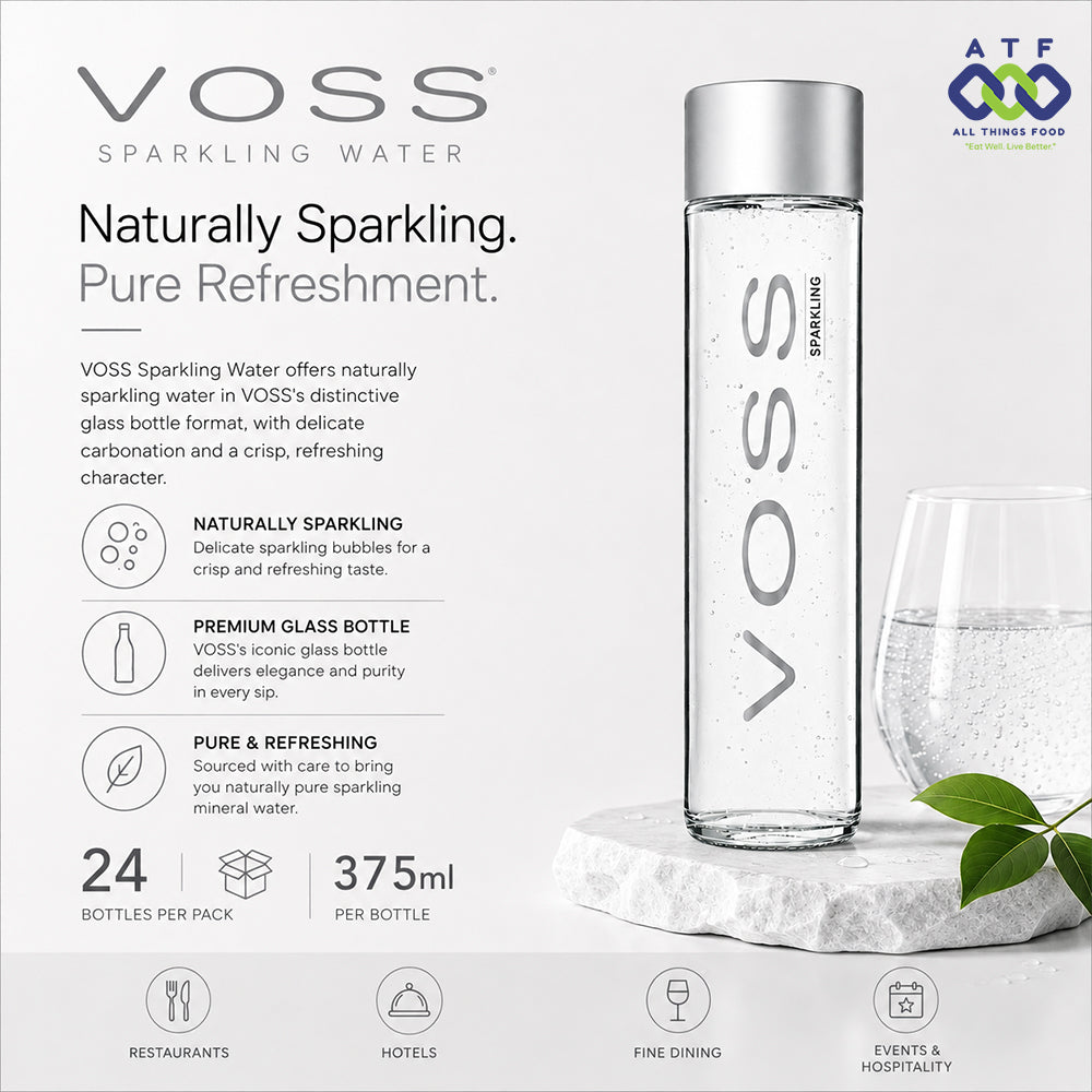 Voss Sparkling Water in a tall clear glass bottle with a silver cap, shown on a light gray promotional background with text, a wine glass, and a marble slab.