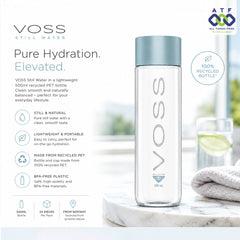 A clear VOSS Still Water 500ml bottle with a light blue cap, displayed on a white marble surface next to a folded white towel.