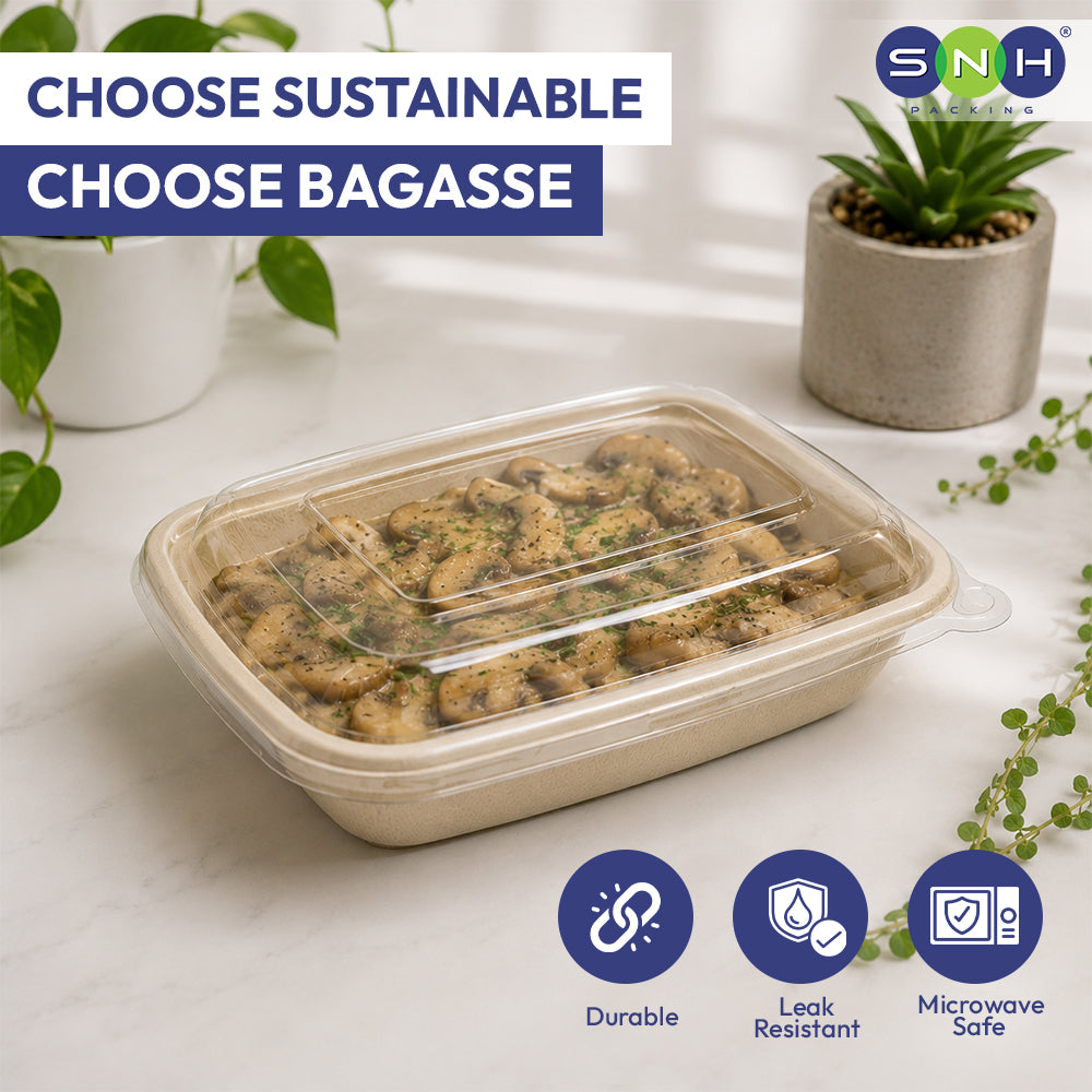 Biodegradable food container with food inside, surrounded by plants on a light surface.