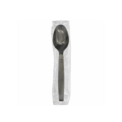Black spoon in a clear plastic package on a white background