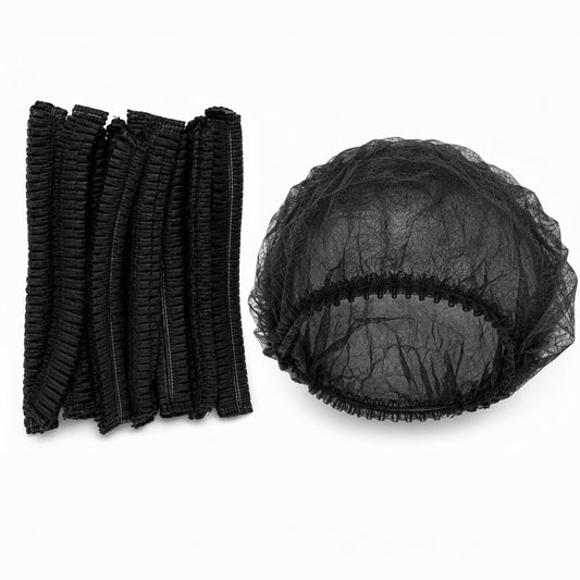 Black disposable shower cap and matching black elastic hair ties, shown on a plain white background.