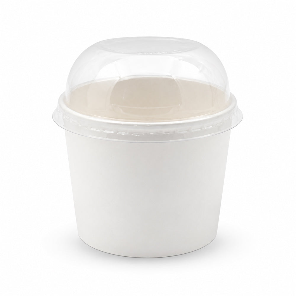 A white paper food container with a clear plastic dome lid