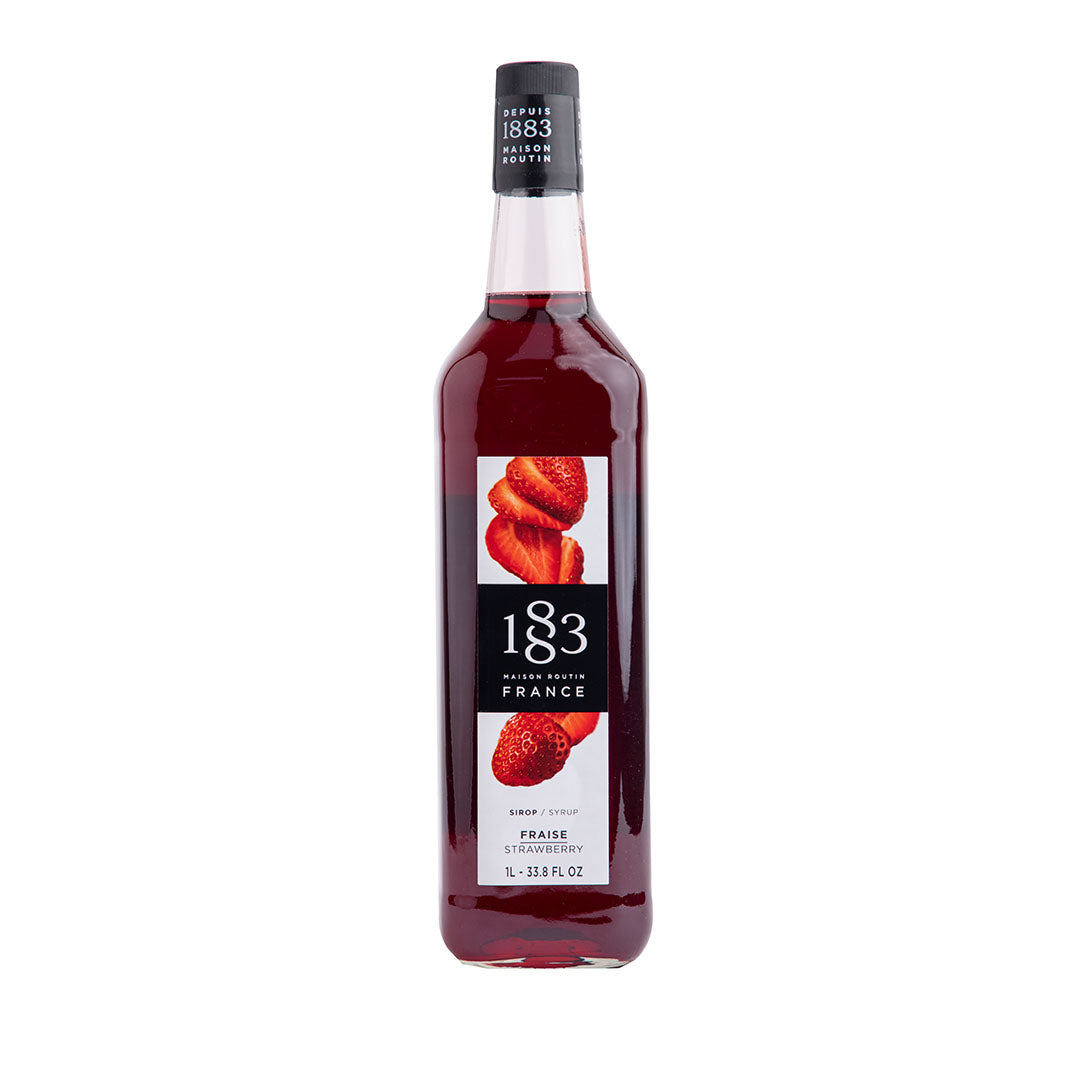 Bottle of 1883 syrup with strawberry flavor on a white background