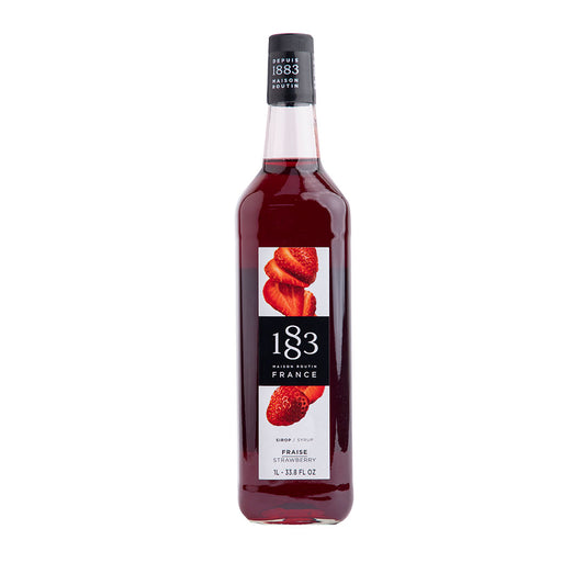 Bottle of 1883 syrup with strawberry flavor on a white background