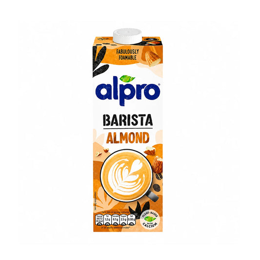 A carton of Alpro Barista Almond milk. The packaging features a white cap and a design with orange, beige, and brown tones, showcasing an illustration of a latte with leaf art.