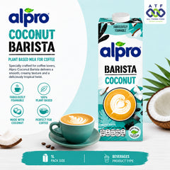 Alpro Coconut Barista plant-based milk carton in a tropical coconut theme, shown alongside a cup of latte macchiato, a sliced coconut