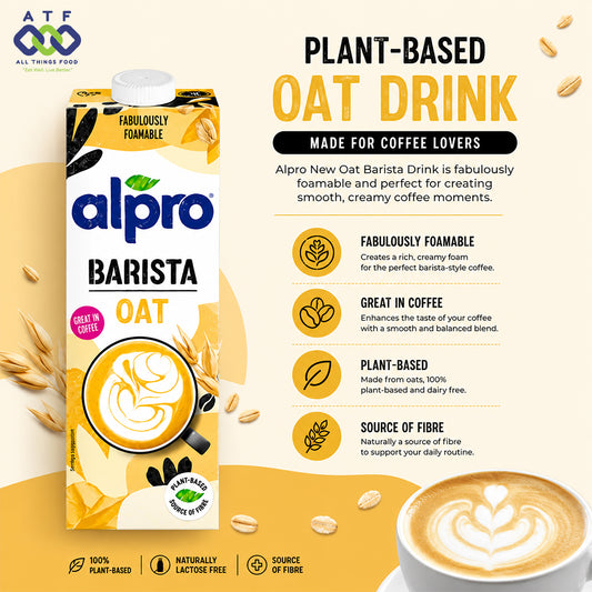 Alpro Barista oat plant-based oat drink carton shown on a warm beige promotional graphic with oat imagery, text callouts, and a latte photo. Visible brand is Alpro.