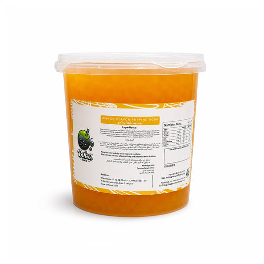 A large plastic tub of orange mango-flavored popping candy with a clear lid and a white label showing product details