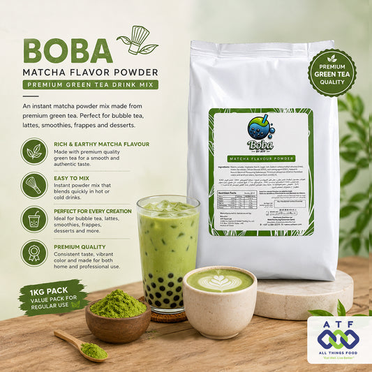 A 1kg bag of BOBA Premium Green Tea Flavor Matcha Powder shown on a styled wooden table with a glass of green matcha tea, a bowl of loose green powder, and a cup of matcha latte. The packaging is white with green and black text and graphics.