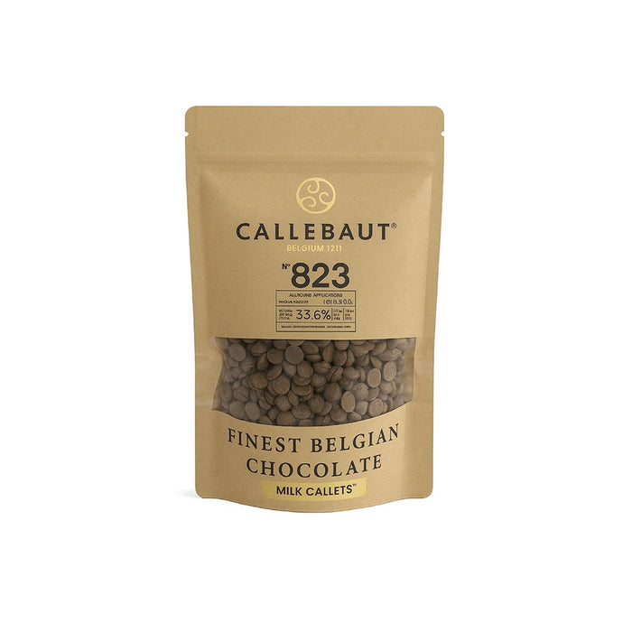 A stand-up pouch of Callebaut 823 Finest Belgian Chocolate Milk Callets. The packaging is a natural kraft paper color with black text and a clear window showing the dark brown chocolate callets inside.