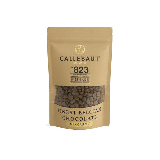 A stand-up pouch of Callebaut 823 Finest Belgian Chocolate Milk Callets. The packaging is a natural kraft paper color with black text and a clear window showing the dark brown chocolate callets inside.