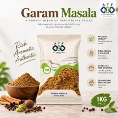 A 1kg package of ATF All Things Food Garam Masala spice blend, displayed alongside a wooden bowl filled with the brown spice powder, whole spices, and cardamom with promotional text and icons.