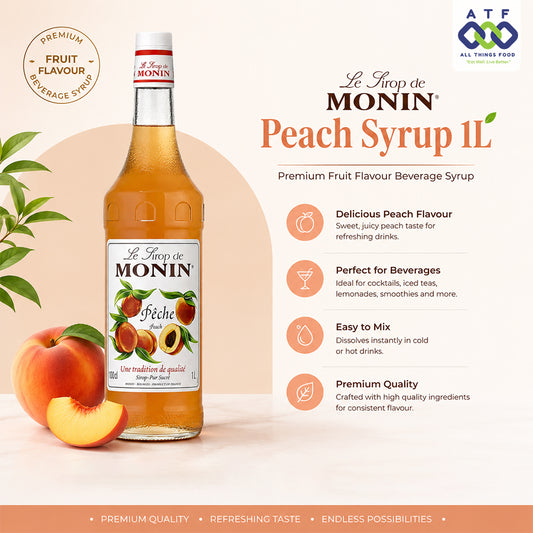 A 1-liter bottle of Le Sirop de Monin Peach Syrup displayed on a clean, light beige background with promotional text and graphics. The bottle is filled with a golden peach-colored liquid and features a white label with red and orange text and illustrations of peaches.