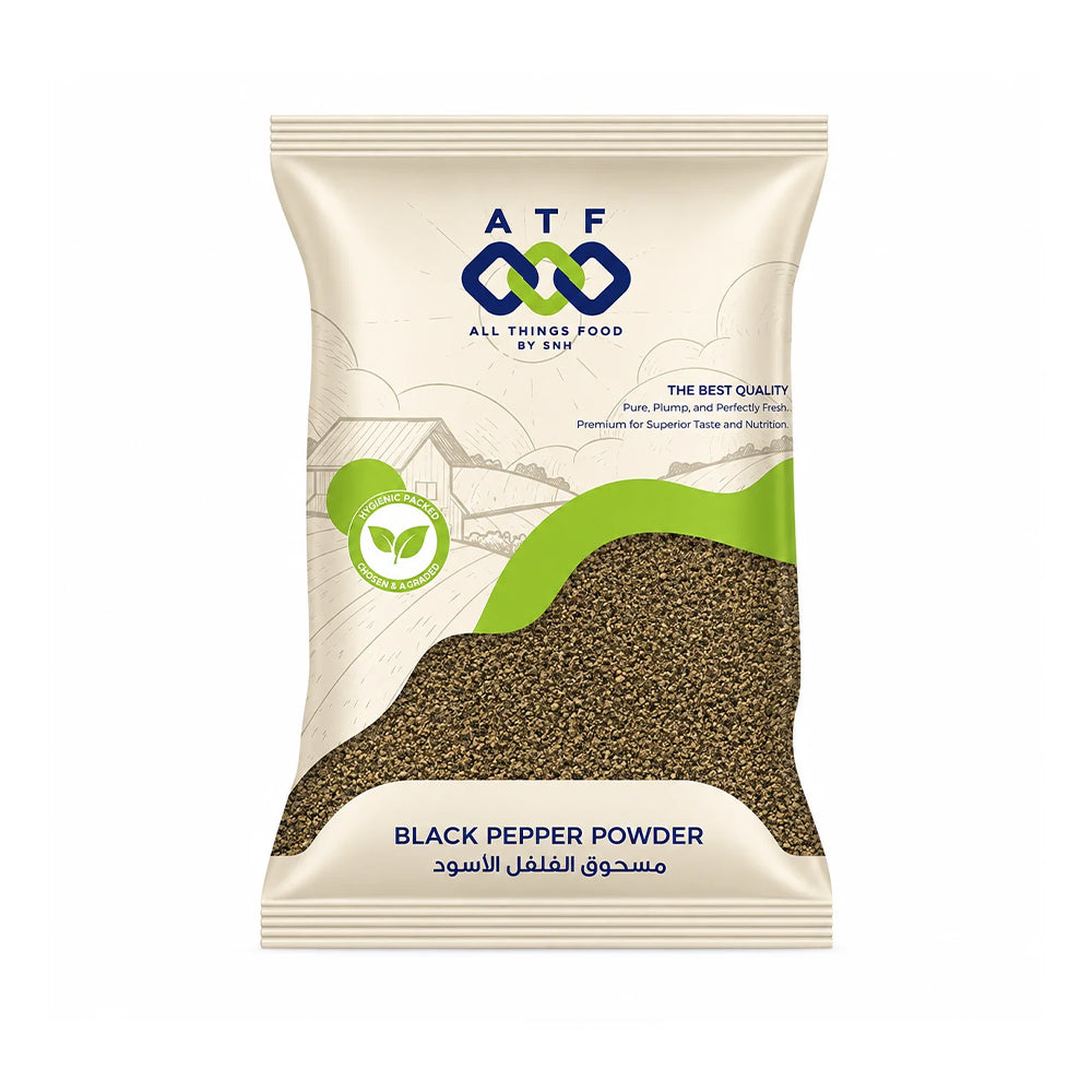 A package of ATF All Things Food by ASU Black Pepper Powder, featuring a cream-colored bag with green and blue branding, a graphic of black pepper flakes, and Arabic text.