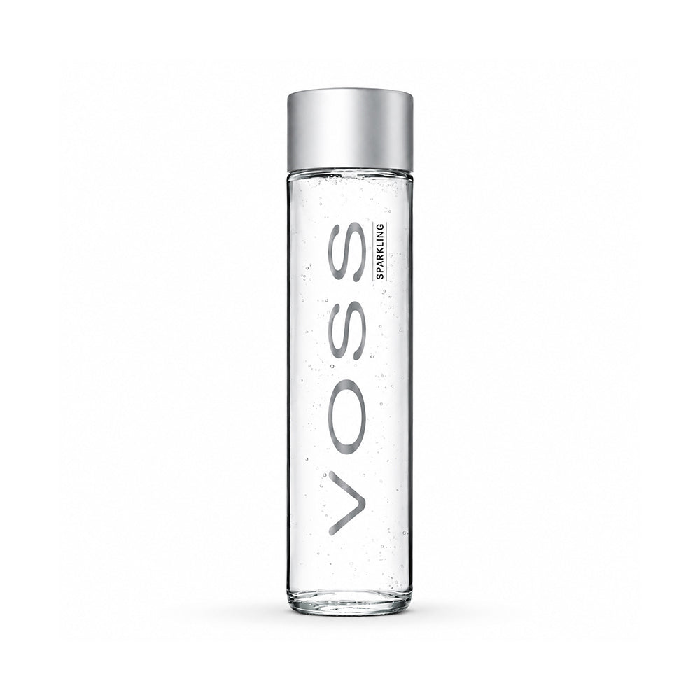 A tall, slender clear glass bottle with a metallic silver cap, featuring the brand name 'VOSS' printed vertically in gray on the front.