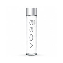 A tall, slender clear glass bottle with a metallic silver cap, featuring the brand name 'VOSS' printed vertically in gray on the front.