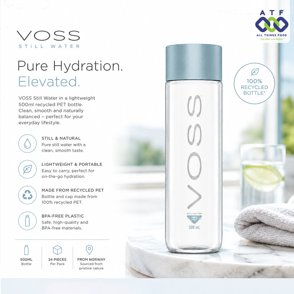 A clear VOSS Still Water 500ml bottle with a light blue cap, displayed on a white marble surface next to a folded white towel. 