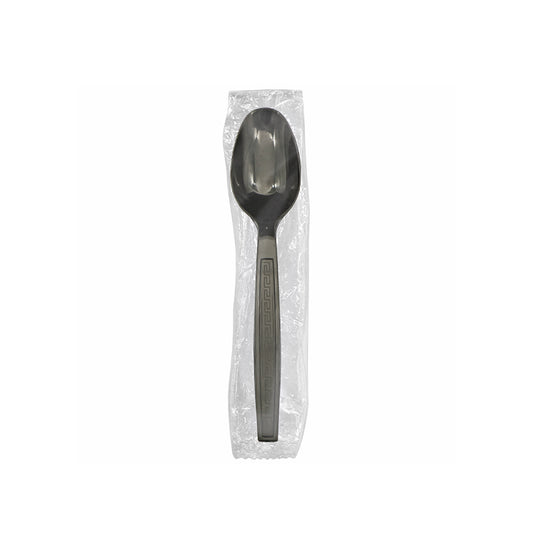 Black spoon in a clear plastic package on a white background