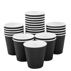 Set of black and white paper cups on a white background