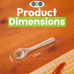 Transparent spoon with measurements on a wooden surface, branded 'SNH'.