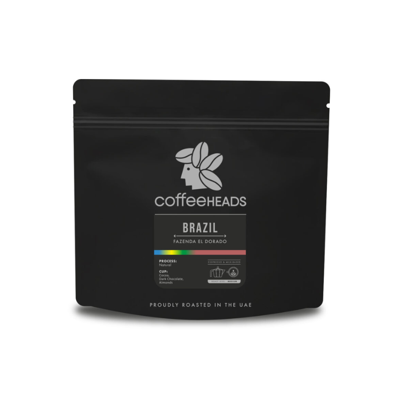 Black coffee packaging with 'Coffeeheads' branding on a white background