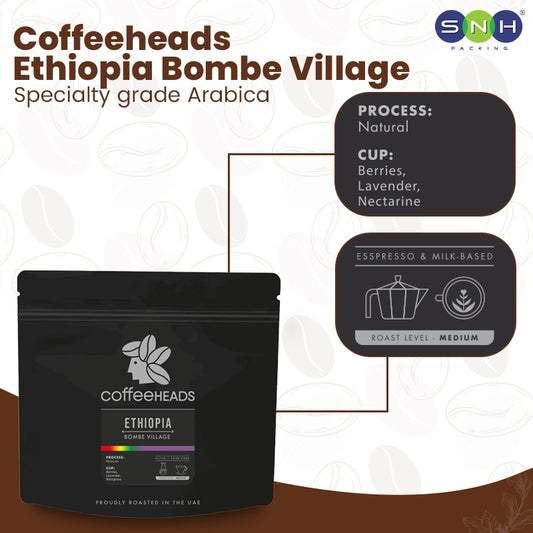 Coffee package labeled 'Coffeeheads Ethiopia Bombe Village' with coffee flavor and process details.
