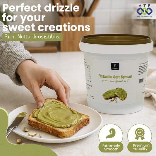 Pistachio soft spread being applied to toast with a container of spread in the background.