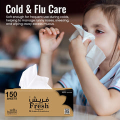 Child using tissues with a box of tissues in the foreground, labeled 'Cold & Flu Care'.