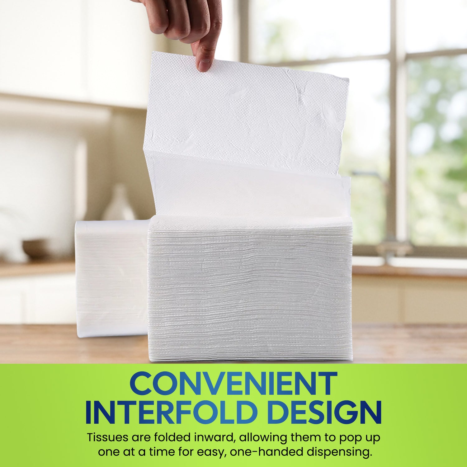 Stack of interfolded tissues with a hand lifting one, set against a blurred kitchen background.