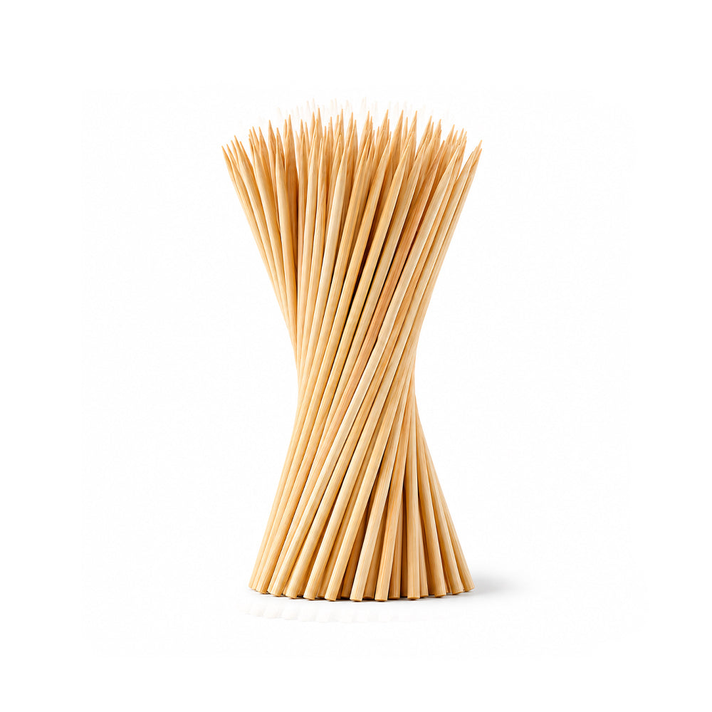Stack of wooden skewers on a white background