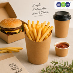 A paper cup of french fries sits on a tabletop next to a burger in a cardboard box, a takeaway coffee cup, a small cup of ketchup, and a branded SNH PACKAGING logo in the top right. Text on the image reads, 'Simple.