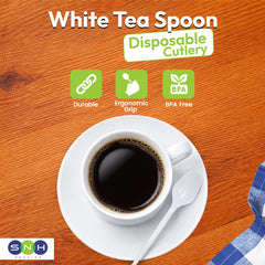White disposable spoon on a saucer with a cup of coffee, against a wooden background, featuring 'White Tea Spoon' branding.